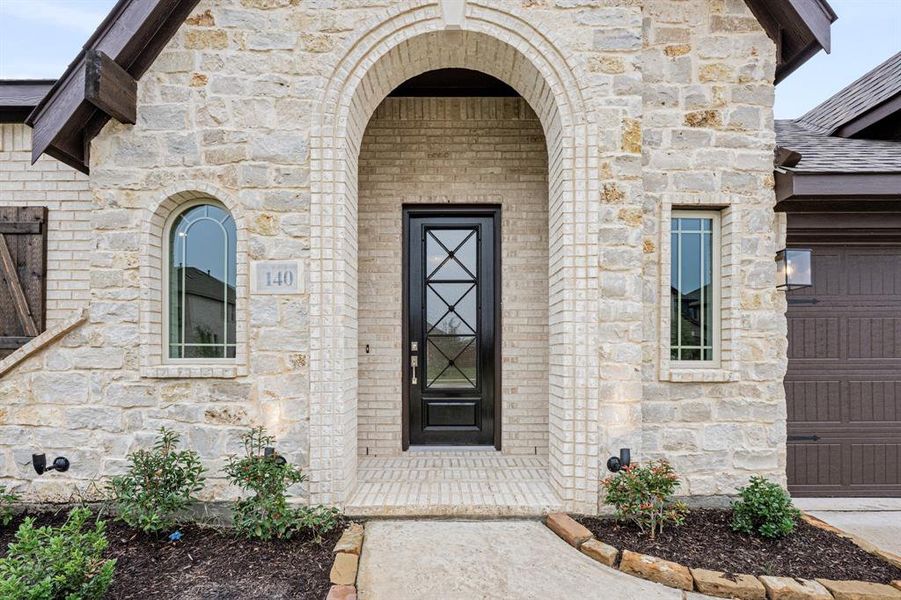 Front exterior of a new home in Hampton Park, Glenn Heights, TX, highlighting curb appeal (Image 2).
