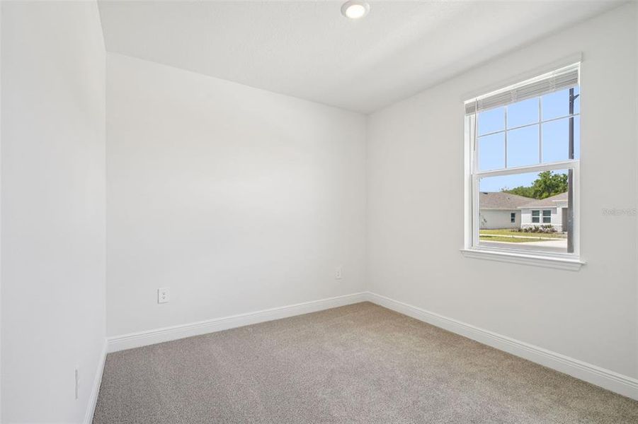 Spacious, unfurnished interior of a new home in The Reserve at Hammock Oaks - Signature Series, Lady Lake (Image 16).