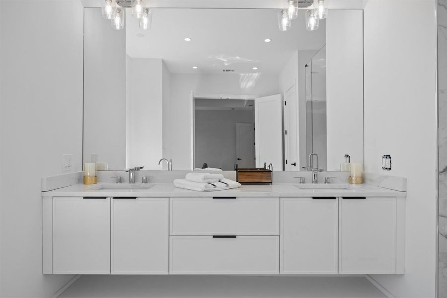 Full bath featuring double sink bathroom vanity