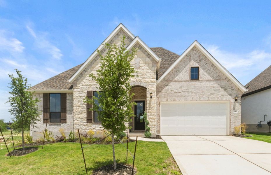 Front exterior of a new home in 6 Creeks, Kyle, TX, highlighting curb appeal (Image 25). Front exterior of a new home in 6 Creeks, Kyle, TX, highlighting curb appeal (Image 25).