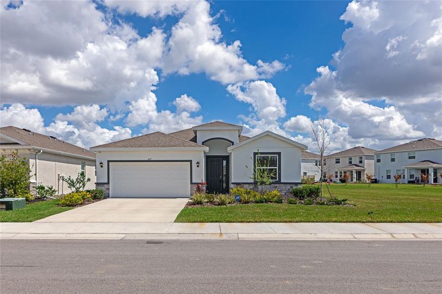 Front exterior of a new home in Coddington, Bradenton, FL, highlighting curb appeal (Image 23).