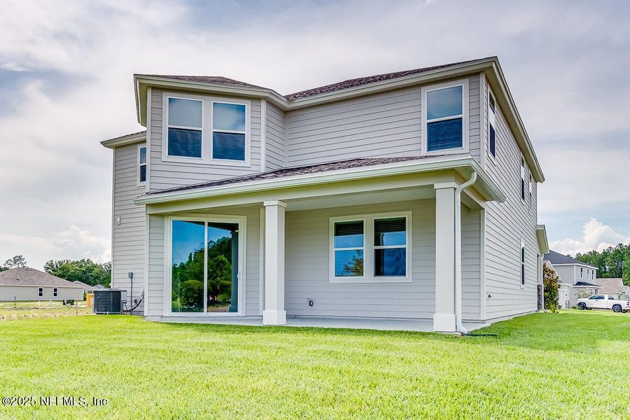 Front exterior of a new home in Copper Ridge, Jacksonville, FL, highlighting curb appeal (Image 18).
