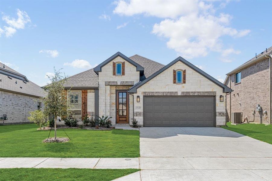 Front exterior of a new home in Woodstone, Providence Village, TX, highlighting curb appeal (Image 2). Front exterior of a new home in Woodstone, Providence Village, TX, highlighting curb appeal (Image 2).