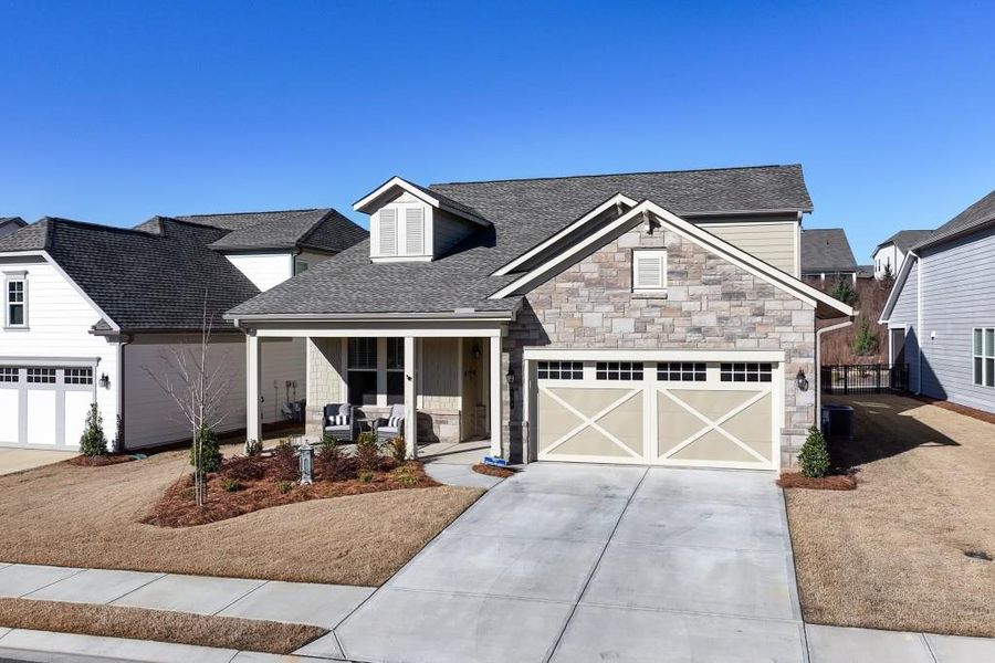 Front exterior of a new home in , Hoschton, GA, highlighting curb appeal (Image 24).