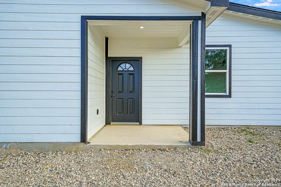 Front exterior of a new home in , Von Ormy, TX, highlighting curb appeal (Image 12). Front exterior of a new home in , Von Ormy, TX, highlighting curb appeal (Image 12).
