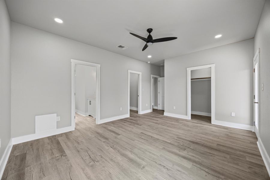 Unfurnished bedroom with recessed lighting, light wood-style floors, and a ceiling fan Unfurnished bedroom with recessed lighting, light wood-style floors, and a ceiling fan