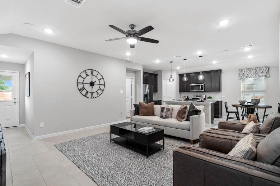 Discover the impressive main living space, featuring high ceilings, contemporary tile flooring, and abundant natural light that highlights the modern finishes and open flow.