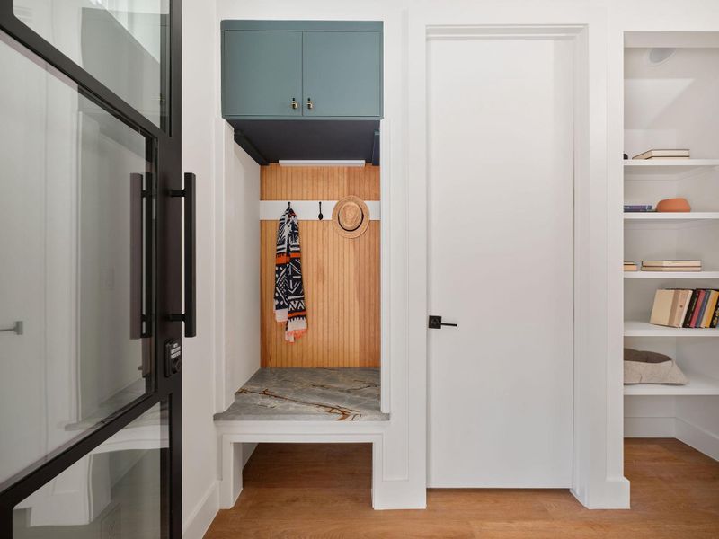 Mudroom with light wood-style flooring Mudroom with light wood-style flooring