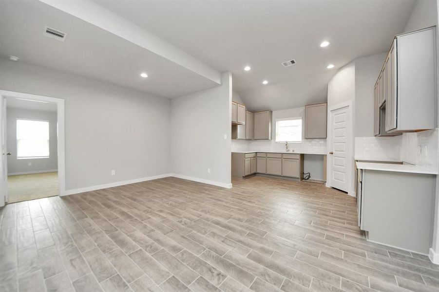 Make memories gathered around the table with your family and friends! This spacious dining room features elegant flooring, custom paint, and adjacent to family room and kitchen for open concept feel.