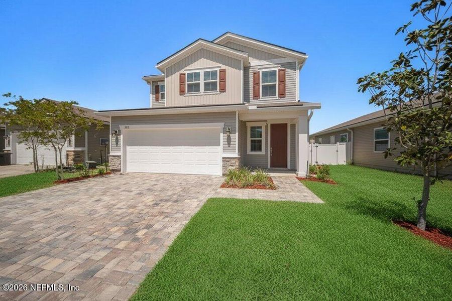 Front exterior of a new home in Verano Creek, St. Augustine, FL, highlighting curb appeal (Image 21).