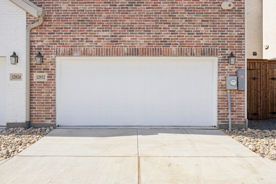 Exterior details and patio area of a home in Newman Village Townhomes, Frisco (Image 3).