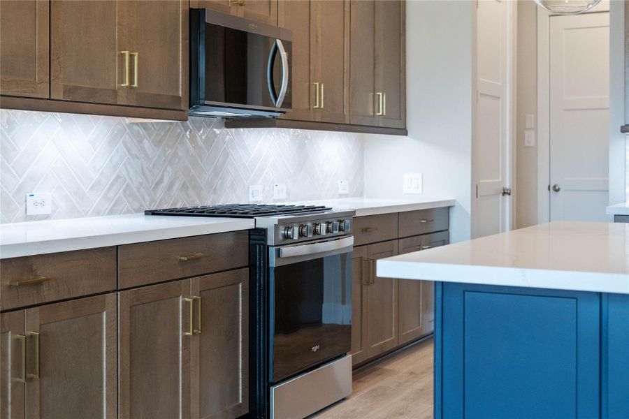 Whirlpool Stainless Steel appliances. Featured here are the gas range and microwave set.