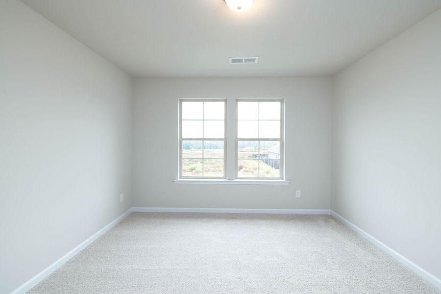 Open and bright bedroom two with a walk in closet