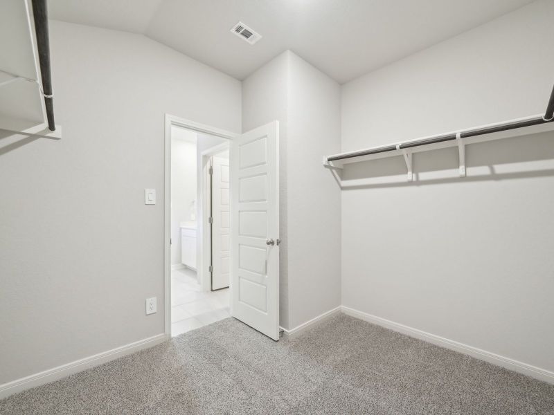 Primary suite walk-in closet in the Briscoe floorplan at a Meritage Homes community. Primary suite walk-in closet in the Briscoe floorplan at a Meritage Homes community.