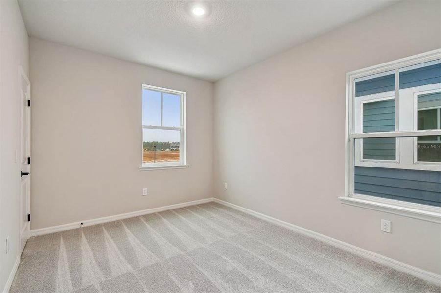 Spacious, unfurnished interior of a new home in Laureate Park at Lake Nona - Garden Series, Orlando (Image 12).
