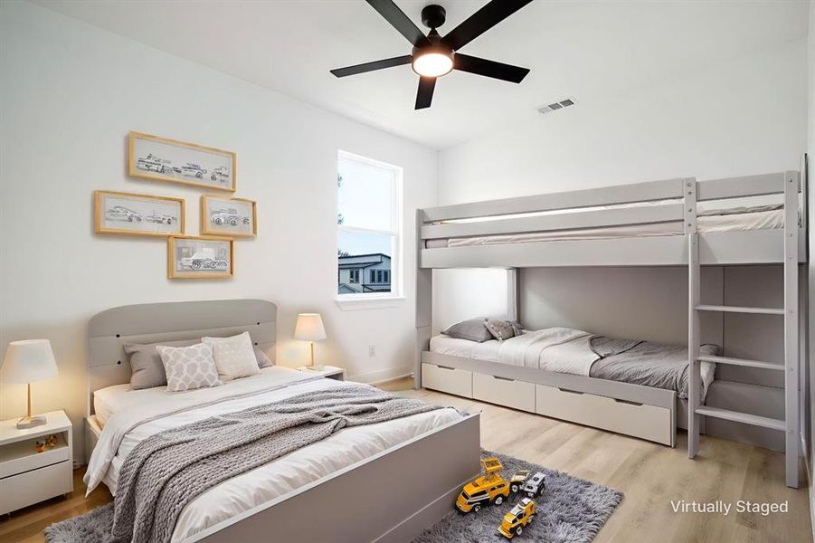 Bedroom featuring light wood-style flooring and a ceiling fan