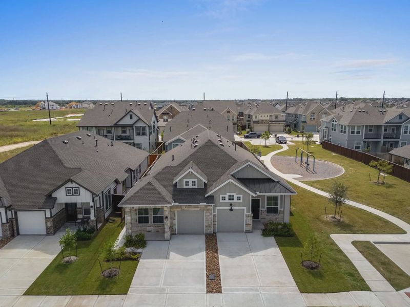 Image 100 representing the Carriagehouse by Chesmar Homes in Meridiana Townhomes, Iowa Colony, TX.
