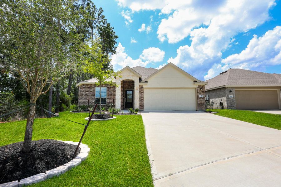 Front exterior of a new home in Ladera Creek, Conroe, TX, highlighting curb appeal (Image 17). Front exterior of a new home in Ladera Creek, Conroe, TX, highlighting curb appeal (Image 17).