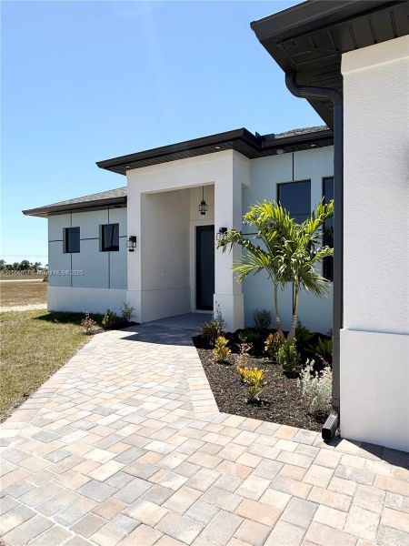 Front exterior of a new home in , Cape Coral, FL, highlighting curb appeal (Image 18).