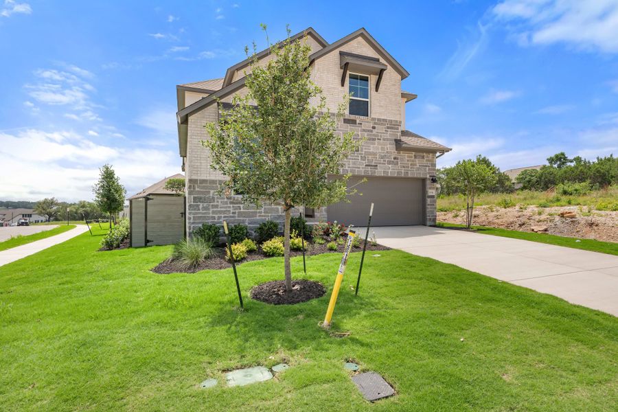 Front exterior of a new home in Wolf Ranch, Georgetown, TX, highlighting curb appeal (Image 28).
