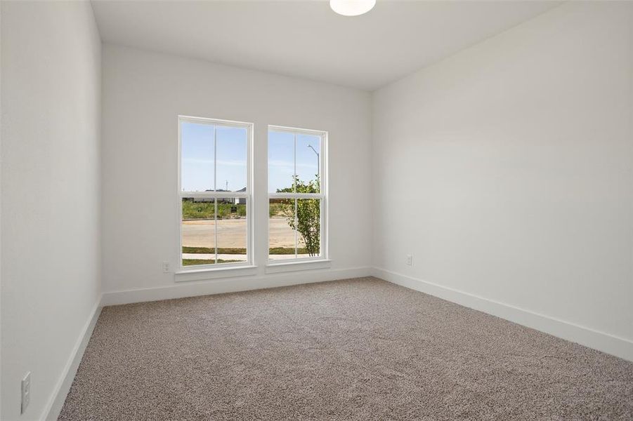 Spare room featuring carpet floors