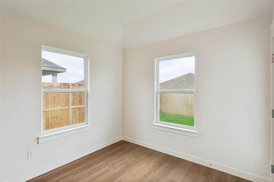 Empty room featuring hardwood / wood-style floors