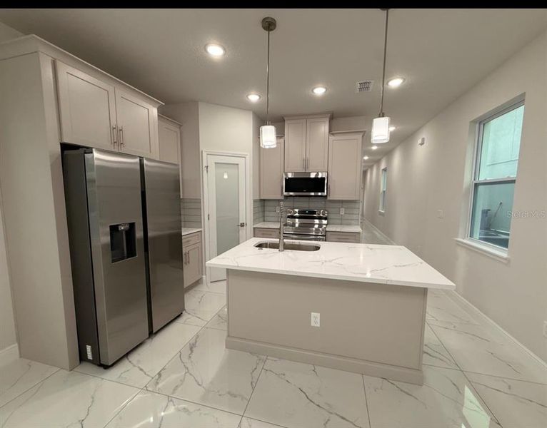 Furnished interior view inside a new home in , Kissimmee (Image 5).
