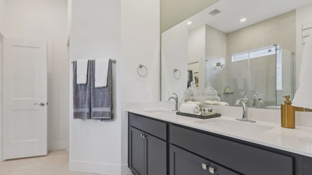 Representative furnished interior of a home built from the Adele by Chesmar Homes in Sunterra, Katy (Image 16).