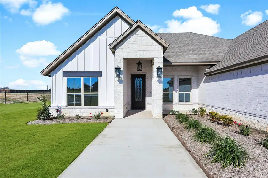 Front exterior of a new home in , Weatherford, TX, highlighting curb appeal (Image 24). Front exterior of a new home in , Weatherford, TX, highlighting curb appeal (Image 24).