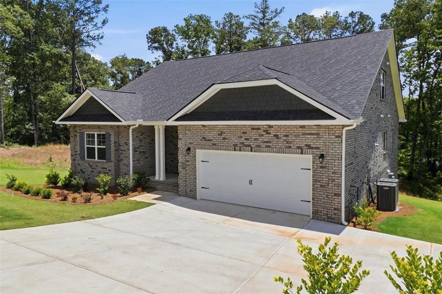 Front exterior of a new home in Tuscany Hills, Douglasville, GA, highlighting curb appeal (Image 19). Front exterior of a new home in Tuscany Hills, Douglasville, GA, highlighting curb appeal (Image 19).