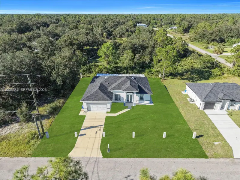 Front exterior of a new home in , Lehigh Acres, FL, highlighting curb appeal (Image 18).