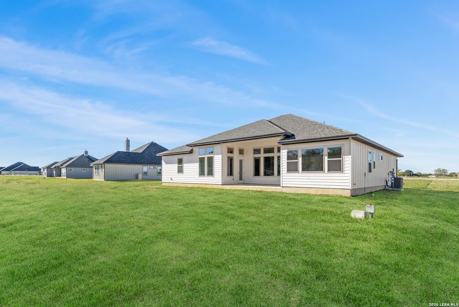 Exterior details and patio area of a home in Pradera Ridge, Floresville (Image 16).