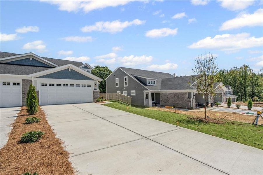 Front exterior of a new home in Villas at Gold Creek, Dawsonville, GA, highlighting curb appeal (Image 21).