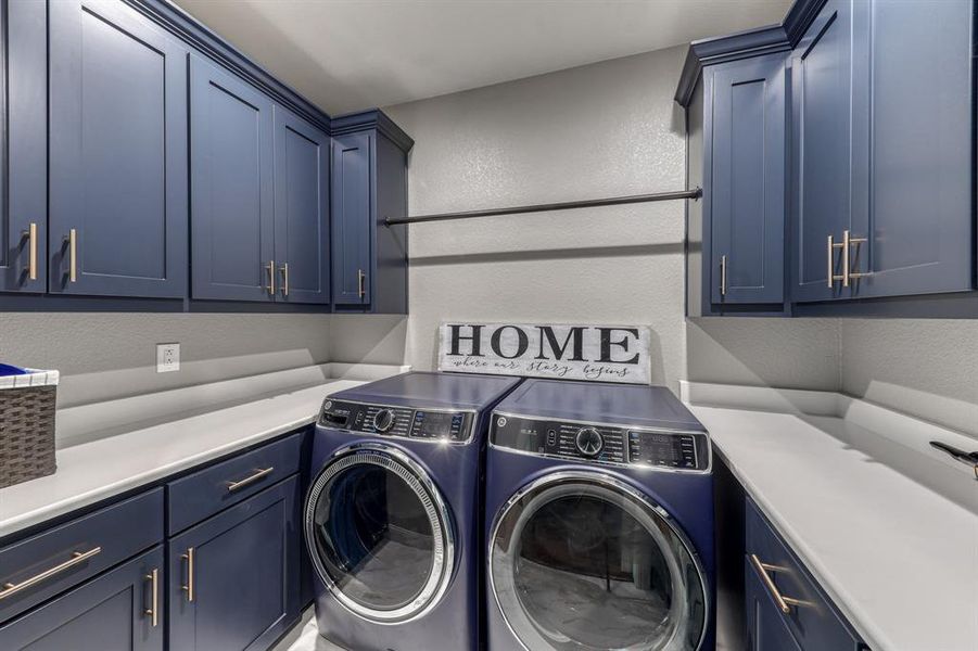 Handy counter space in a dedicated utility room with plenty of cabinet storage.