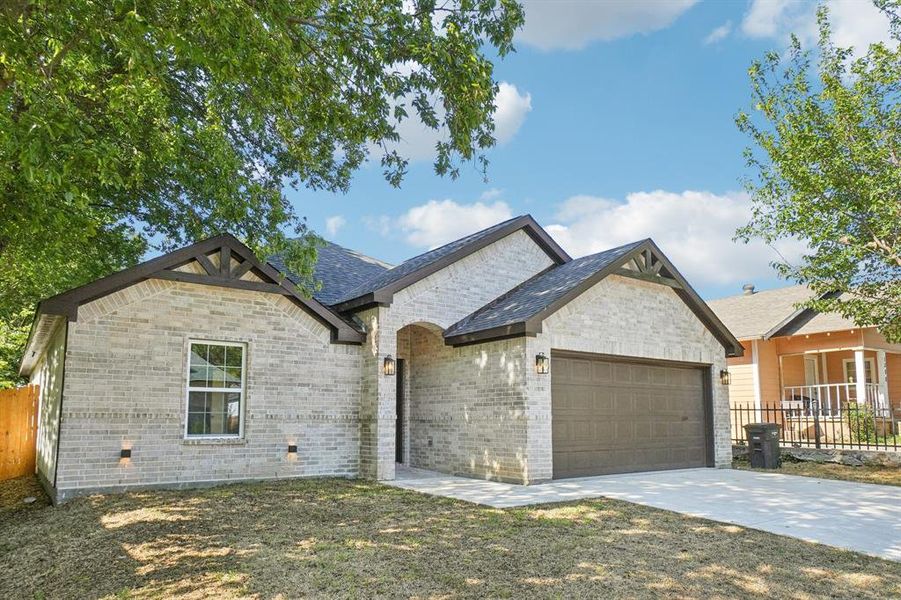 View of front of house featuring an attached garage, concrete driveway, and brick siding View of front of house featuring an attached garage, concrete driveway, and brick siding