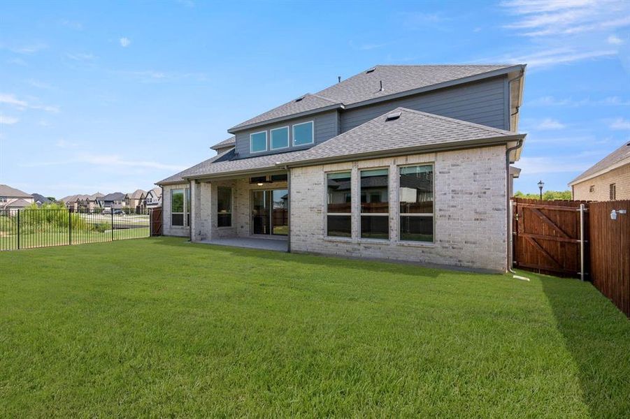 Front exterior of a new home in Birdsong, Mansfield, TX, highlighting curb appeal (Image 24).