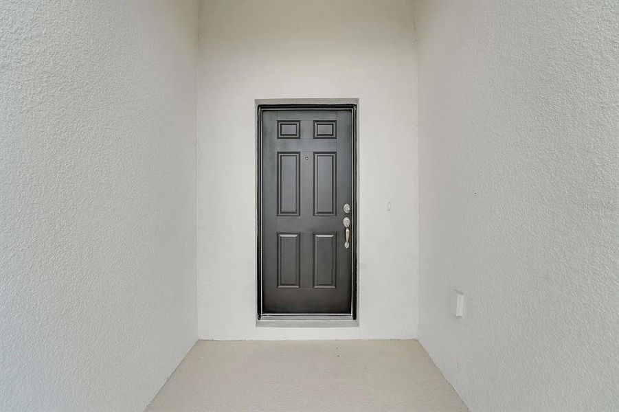 Exterior details and patio area of a home in Cypress Park Estates, Haines City (Image 25).