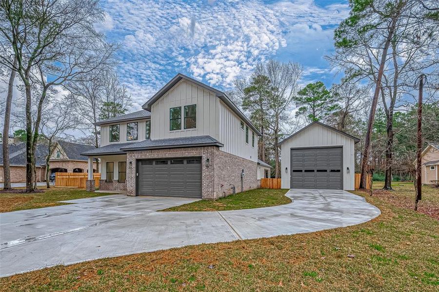 Lots of parking and includes 22x35 shop/garage, set amidst a wooded area, offering a blend of privacy and convenience.