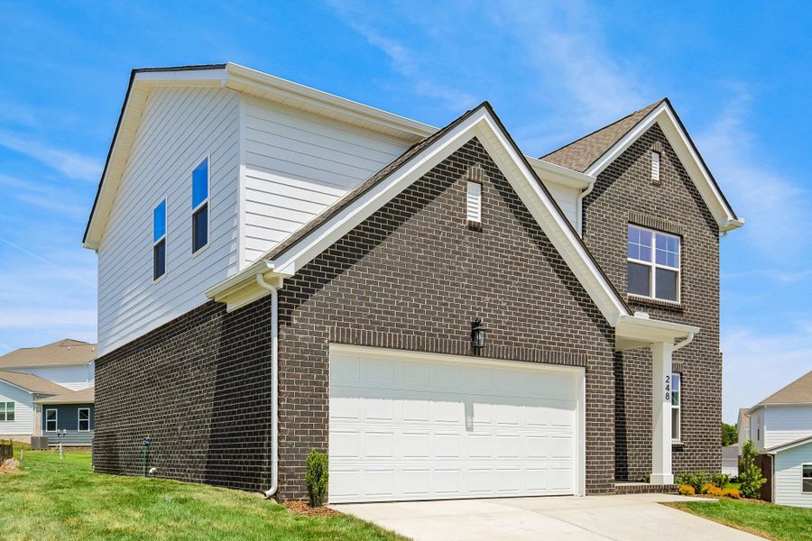 Front exterior of a new home in Cades Bluff, Lebanon, TN, highlighting curb appeal (Image 2). Front exterior of a new home in Cades Bluff, Lebanon, TN, highlighting curb appeal (Image 2).