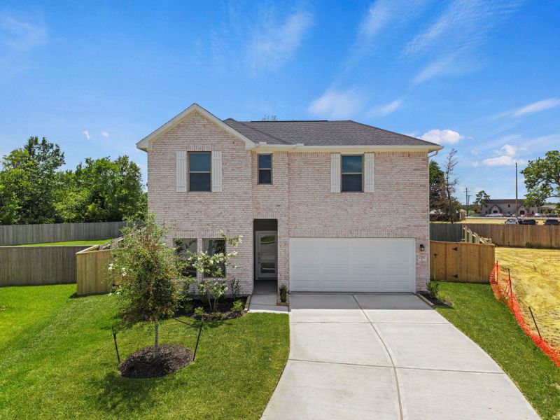 Front exterior of a new home in Laurel Landing, Alvin, TX, highlighting curb appeal (Image 22). Front exterior of a new home in Laurel Landing, Alvin, TX, highlighting curb appeal (Image 22).