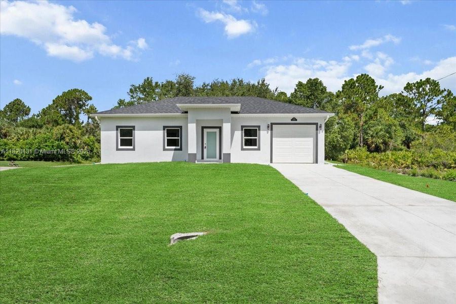 Front exterior of a new home in , Lehigh Acres, FL, highlighting curb appeal (Image 1). Front exterior of a new home in , Lehigh Acres, FL, highlighting curb appeal (Image 1).