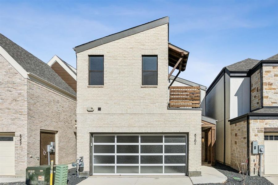 Contemporary house featuring front entry garage