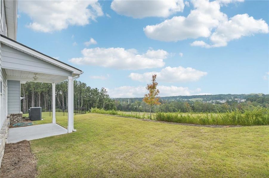 Exterior details and patio area of a home in The Hills at Cedar Creek, Winder (Image 21).