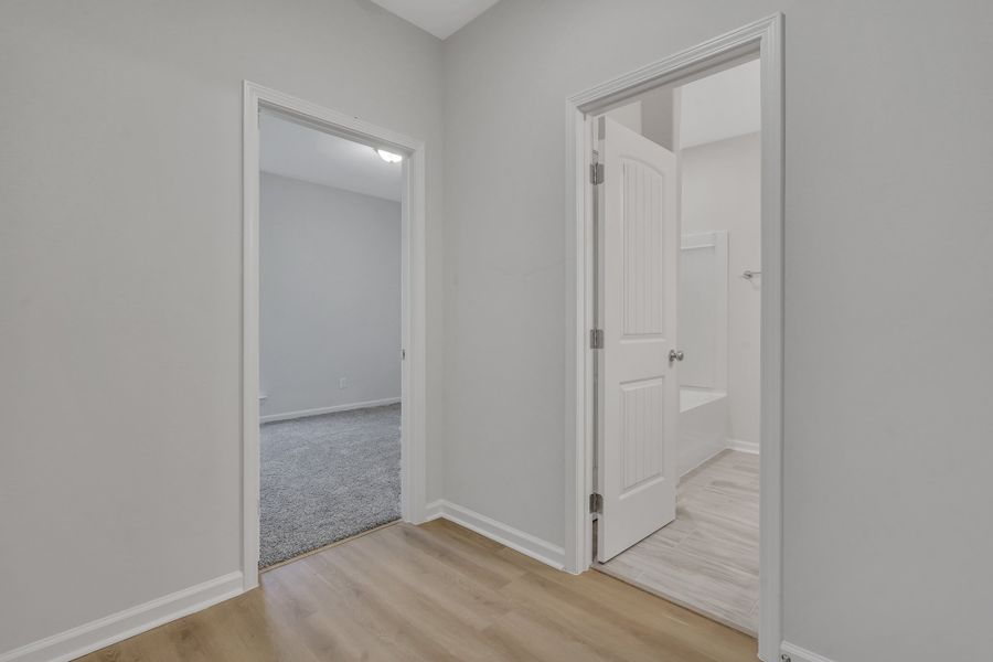 Representative unfurnished interior of a home built from the The Hatteras by Smith Family Homes in Ramsey Landing, Rincon (Image 22).