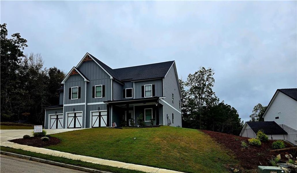 Front exterior of a new home in Silvercrest Lakes, Acworth, GA, highlighting curb appeal (Image 29).