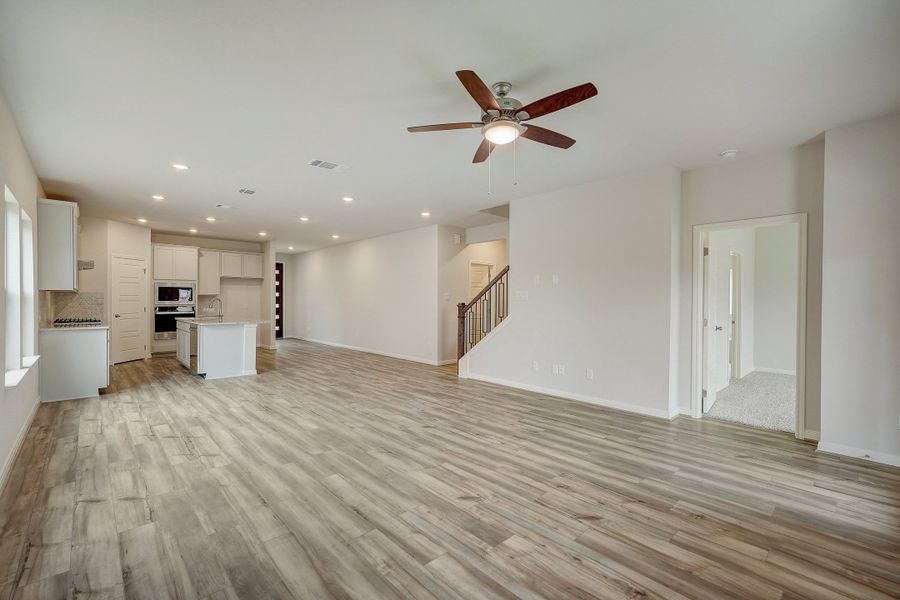 Living room, dining room, and kitchen in the Pearl floorplan at a Meritage Homes community.