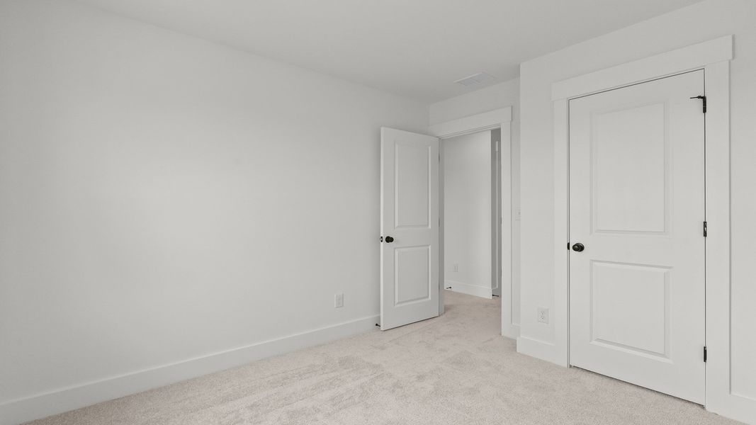 The Brookgreen secondary bedroom at Seabreeze blends comfort, function, and coastal charm.