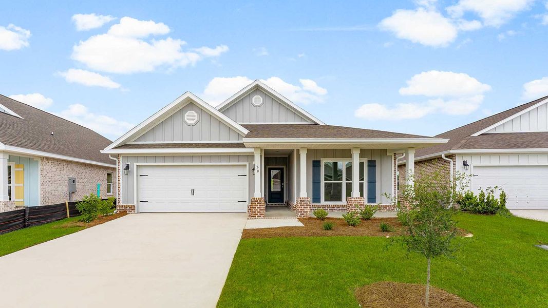 Front exterior of a new home in Owl's Head Farms, Freeport, FL, highlighting curb appeal (Image 1). Front exterior of a new home in Owl's Head Farms, Freeport, FL, highlighting curb appeal (Image 1).