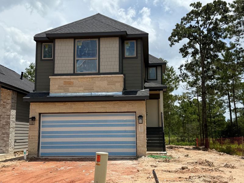 Front exterior of a new home in Kresston, Montgomery, TX, highlighting curb appeal (Image 9). Front exterior of a new home in Kresston, Montgomery, TX, highlighting curb appeal (Image 9).