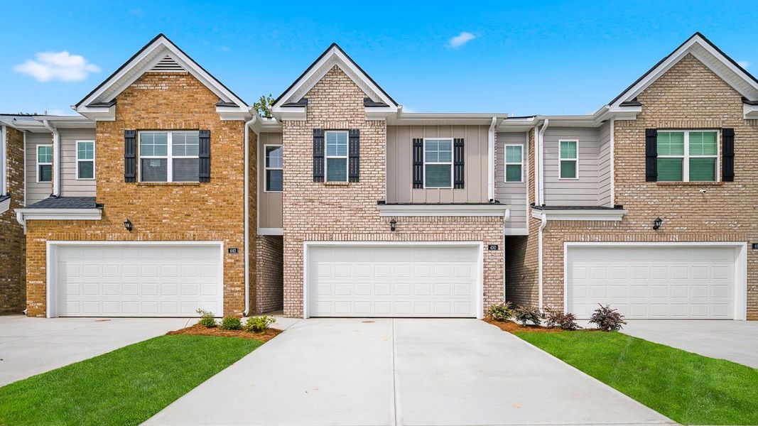 Front exterior of a new home in Independence Villas and Townhomes, Loganville, GA, highlighting curb appeal (Image 1). Front exterior of a new home in Independence Villas and Townhomes, Loganville, GA, highlighting curb appeal (Image 1).